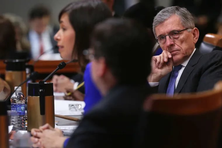 FCC chair Tom Wheeler listens as Commissioner Jessica Rosenworcel (left) speaks during an open meeting to receive public comment on the proposed Internet rules.