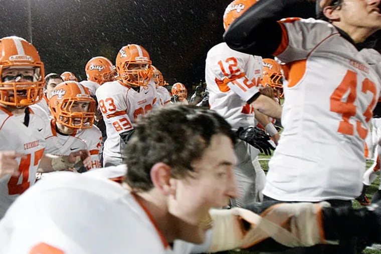 Cherokee players charge the field after winning the Rancocas Valley vs
Cherokee H.S. South Jersey Group 5 title football game, at Rowan
University. (Elizabeth Robertson/Staff
Photographer)