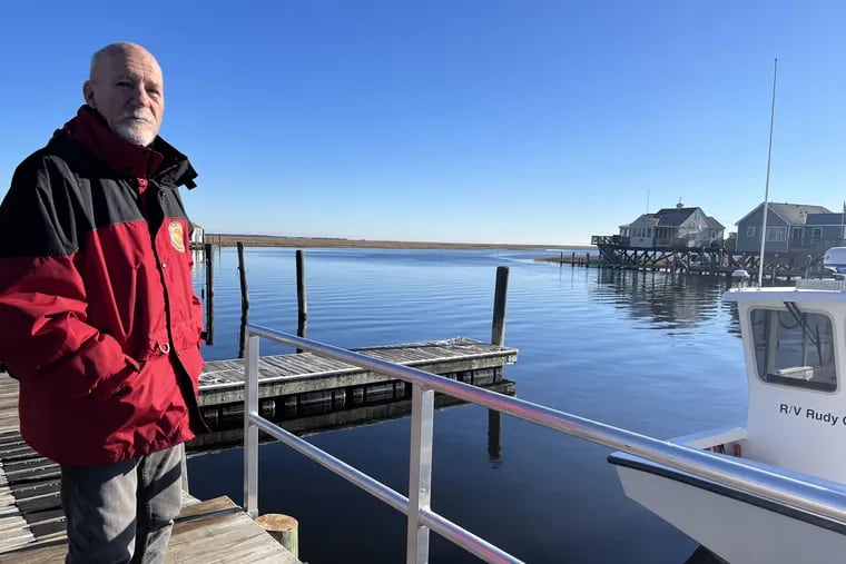 Stewart Farrell, 80, director of Stockton University's Coastal Research Center, on a dock next to the center on Nacote Creek in Atlantic County. Farrell is retiring in January after being with the state university since it first opened in 1971.