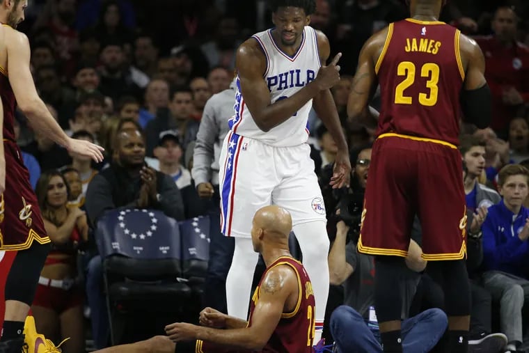Sixers’ Joel Embiid taunts Cavaliers’ Richard Jefferson after getting fouled.