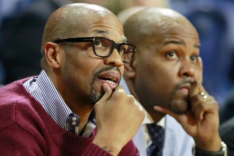 Penn Head Coach Jerome Allen, left, and Assistant Coach Ira Bowman during their game against Princeton on March 10, 2015.