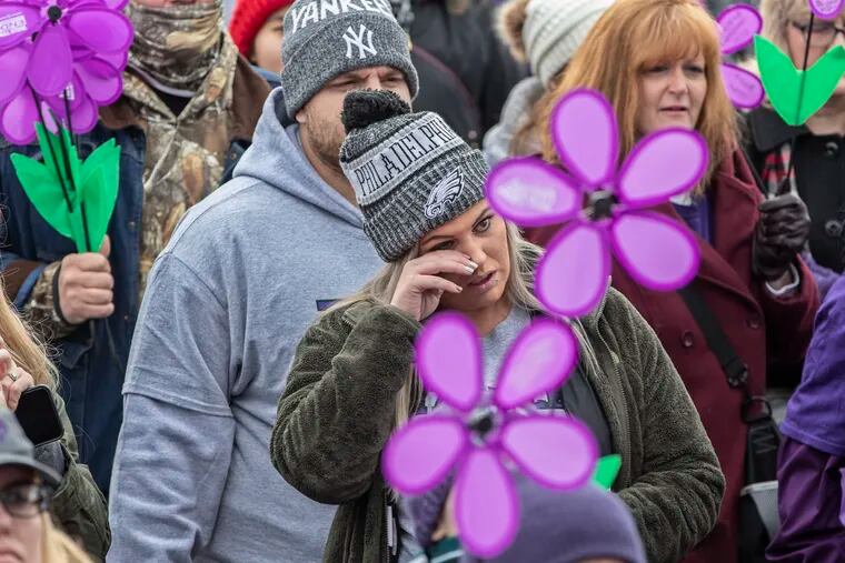 Brittany Bernard wipes away tears during the Promise Garden ceremony held prior to the 2019 Walk to End Alzheimer's at Citizens Bank Park on Sunday. She was there to honor her grandfather William Serody, who died from the disease. She is pregnant with a son, whom she plans to name William to honor his memory, she said.