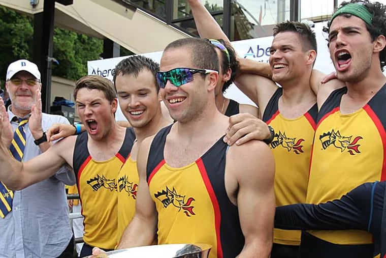 Senior captain Kurt Linton, center, and the Drexel University Men's
Varsity Heavyweight Eight hold the Richard O'Brien trophy after
winning the finals in the event at the Dad Vail Regatta on May 11,
2013. (Charles Fox/Staff Photographer)