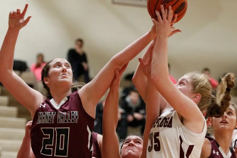 Emily McAteer (left) of Garnet Valley battles for a rebound with Liz Scott (center) and Emma Powell (2nd from right) of  Conestoga in the 1st quarter of a girls basketball game on Jan 18, 2017.   CHARLES FOX / Staff Photographer