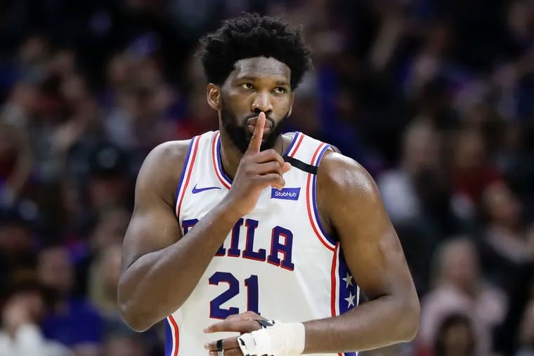 Joel Embiid put his finger up to his lips after making a three-point basket against the Chicago Bulls late in the fourth quarter Sunday.