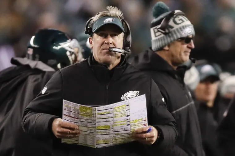 Eagles coach Doug Pederson holds his play chart against the Atlanta Falcons in a NFC Divisional Playoff game on Saturday, January 13, 2018 in Philadelphia.
