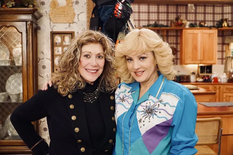 Beverly Goldberg (left) with Wendi McLendon-Covey, who plays her as a character in the 1980s, on the set of ABC's "The Goldbergs" in February. Goldberg -- the real one -- is the author of "The Goldbergs Cookbook," a collection of her recipes that have been featured on the Jenkintown-set show, which was created by her son, Adam F. Goldberg.