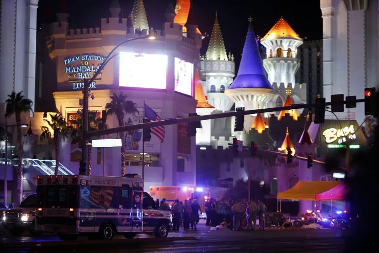 Las Vegas Metro Police and medical workers stage in the intersection of Tropicana Avenue and Las Vegas Boulevard South after a mass shooting at a music festival on the Las Vegas Strip Sunday, Oct. 1, 2017.