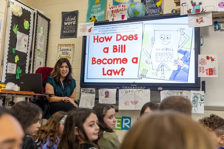 Erin Zarzycki, 4th grade Teacher at the Eleanor Rush Intermediate School, is teaching her class about how bills become laws and how they will make cranberry juice the official New Jersey beverage in Cinnaminson, N.J., on Tuesday, Jan. 31, 2023.