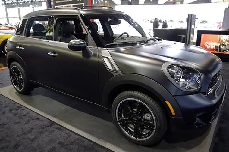 A 2014 Mini Cooper S Countryman All4 is on display during the media preview at the Chicago Auto Show at McCormick Place in Chicago. The four-door Countryman was the only one of 12 cars to earn a �good� rating in new frontal crash tests performed by the Insurance Institute for Highway Safety, an Arlington, Va.-based safety group that�s funded by insurers. (AP photo/Nam Y. Huh)