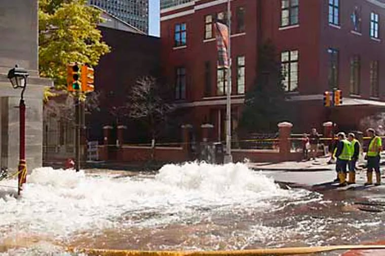 Crews are on the scene of a recent water main break at 3rd and Walnut Streets in Old City. (Ryan S. Greenberg / Staff Photographer)