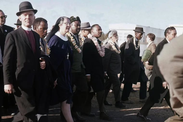 File: In this March 1965 file photo, Martin Luther King, center, leads a march from Selma to Montgomery, Ala. In early 1965, King's Southern Christian Leadership Conference began a series of marches as part of a push for black voting rights. (AP Photo/File)