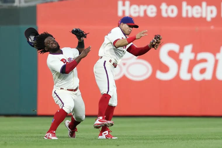 Odubel Herrera collides with Cesar Hernandez during the Phillies' 3-1 loss to the Mets on Saturday.