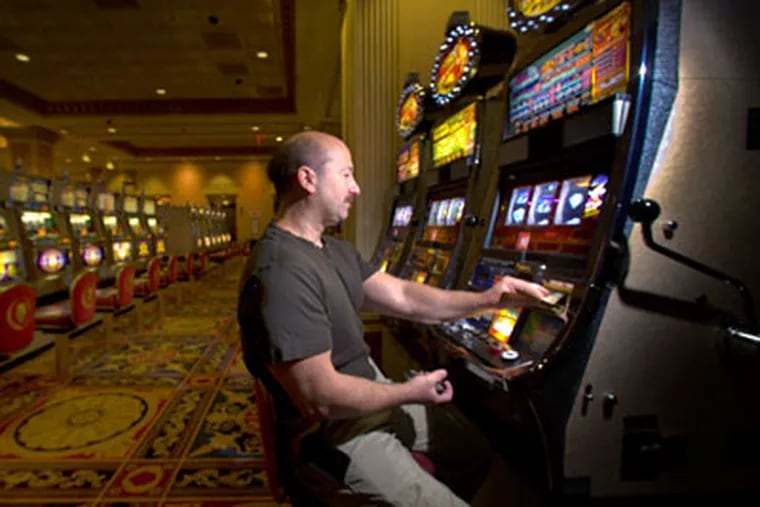 Jim Salvador, 45, a utilities manager from Westchester, NY is a regular at casinos in Connecticut, Las Vegas and Atlantic City. Here he plays the slot machines at Caesars. ( Ed Hille / Staff Photographer )