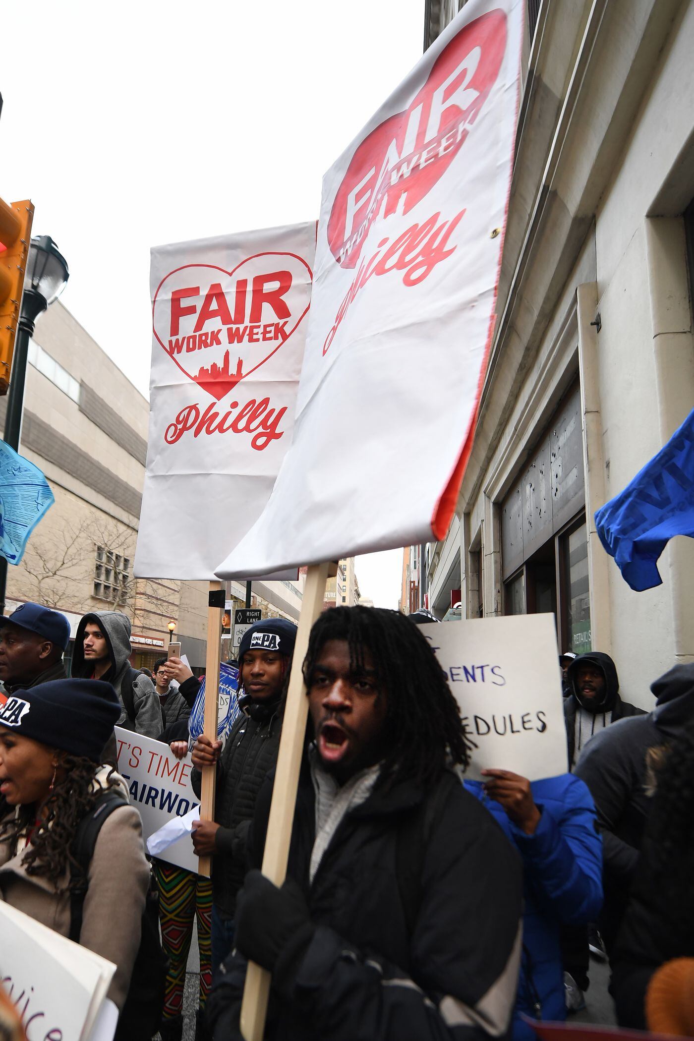Zaire Best marches along fast food and retail workers on Tuesday near City Hall.