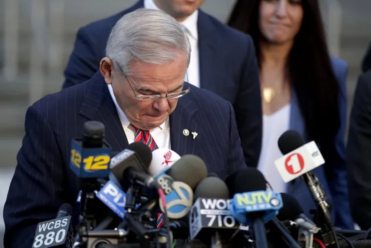 Sen. Bob Menendez fights tears Thursday while speaking to reporters outside Martin Luther King Jr. Federal Courthouse after U.S. District Judge William H. Walls declared a mistrial.