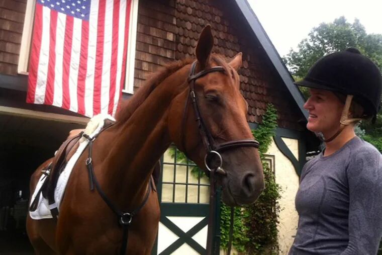 Sara Baughn, of South Philadelphia, prepares to ride Peter's Legend at Still Pond Farm in Moorestown. He's one of a dozen retired racehorses awaiting new homes. (Kevin Riordan/ staff)