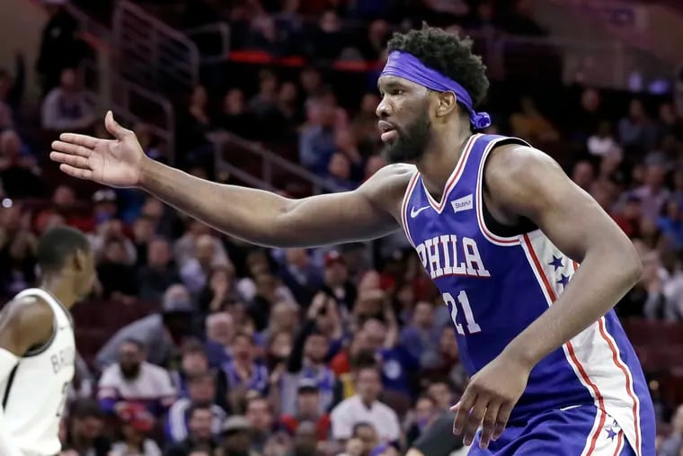 Joel Embiid heads back on defense after scoring a fourth-quarter basket against the Nets.