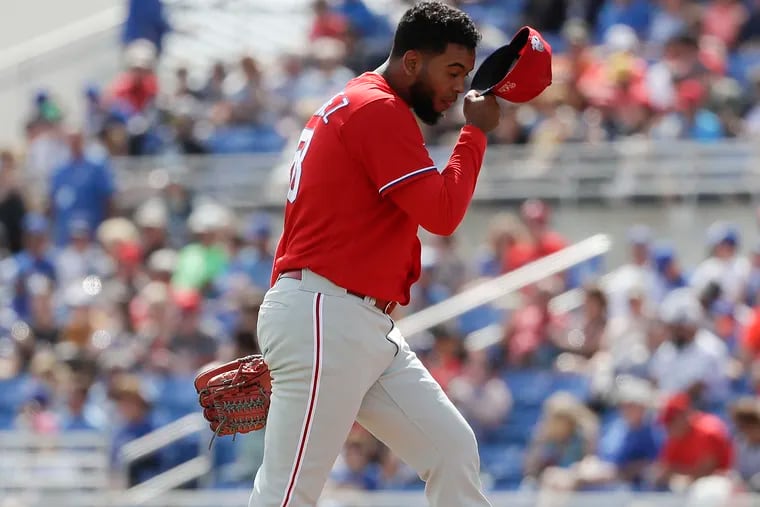 Phillies pitcher Seranthony Dominguez prepares to pitch against the Toronto Blue Jays in a spring training game at TD Ballpark in Dunedin, Fla., in March, before being shut down for surgery.