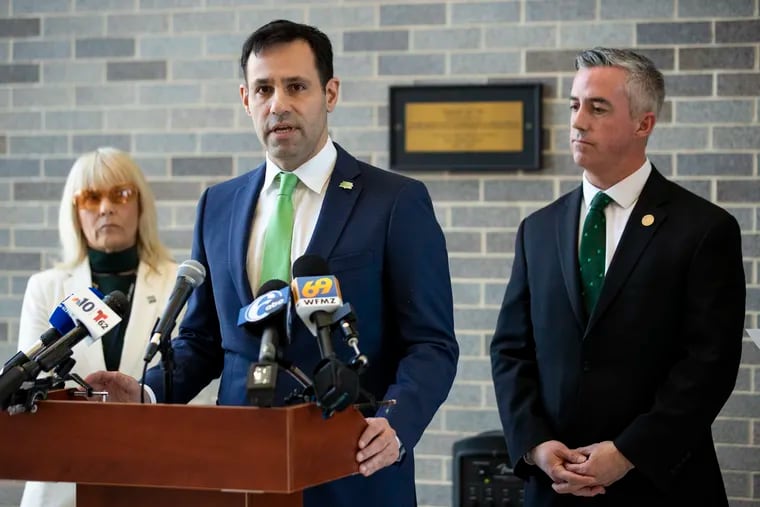 (left to right) County Commissioner Diane M. Ellis-Marseglia, Solicitor Joe Khan, and County Commissioner Robert J. Harvie Jr. stand together during a news conference in Doylestown in March. Khan is now running for Pennsylvania attorney general.