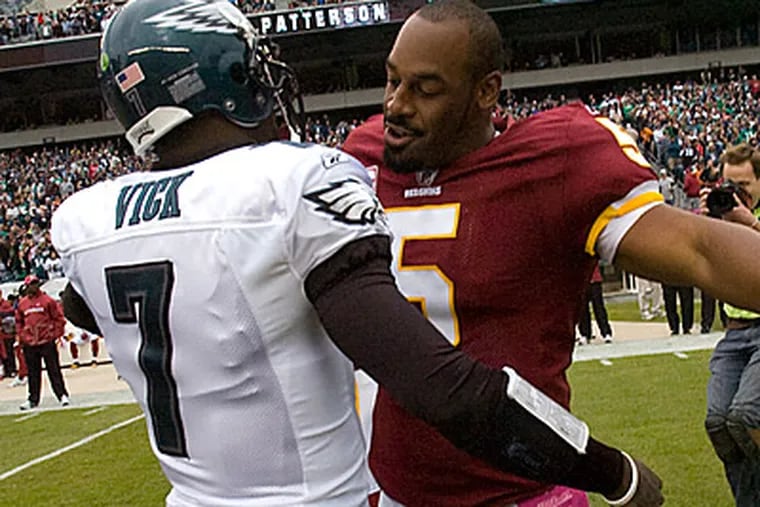 It has been a strange year for Michael Vick and former Eagles quarterback Donovan McNabb. (Clem Murray/Staff file photo)
