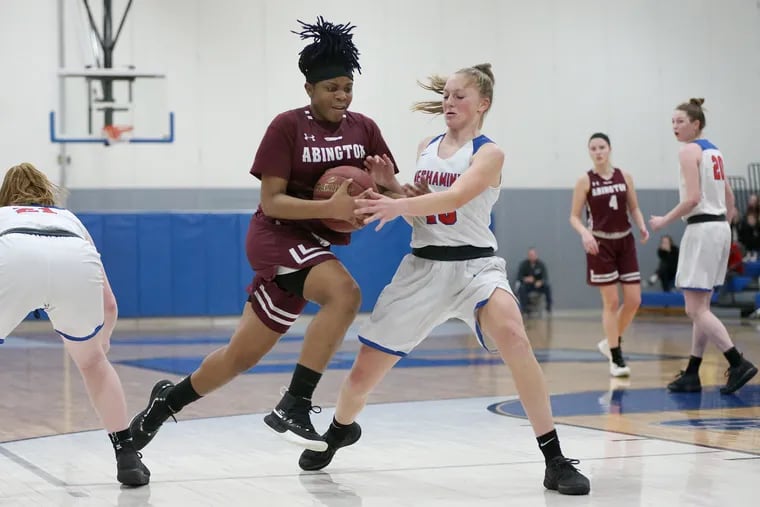Abington's Khalis Whiting is guarded by  Neshaminy's Emily Tantala during the district semifinal.