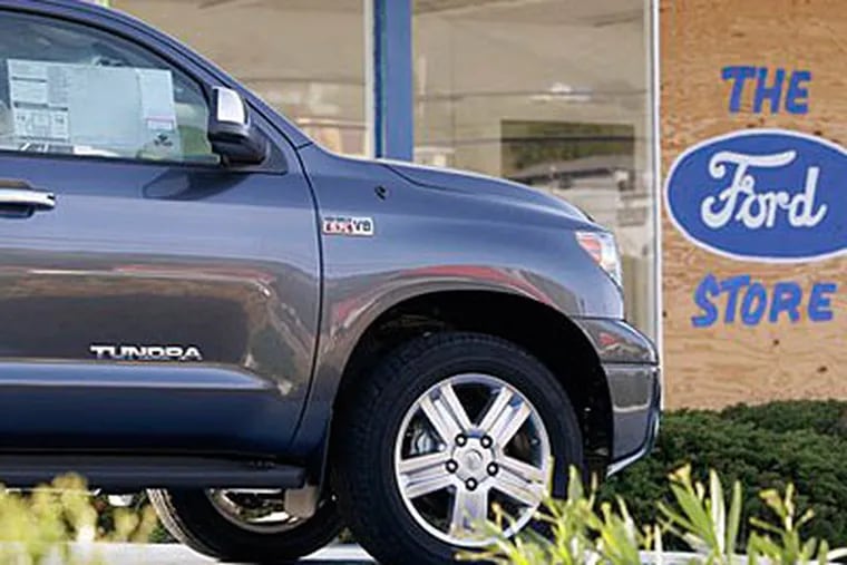 A new Toyota Tundra truck sits at a Ford dealership that closed Friday in Hayward, Calif. (AP Photo/Ben Margot)