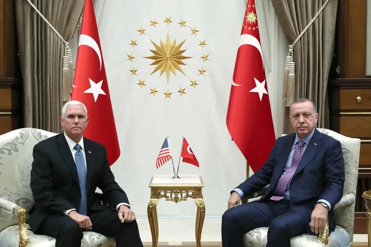 In this handout image provided by the Turkish presidency, Turkish President Recep Tayyip Erdogan receives U.S. Vice President Mike Pence at Presidential Complex in Ankara, Turkey.