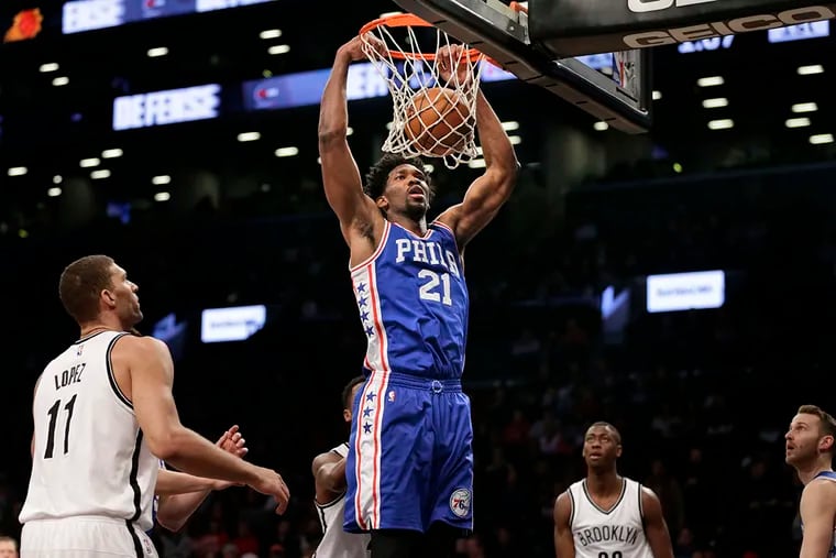 Philadelphia 76ers' Joel Embiid (21) dunks during the first half of the NBA basketball game against the Brooklyn Nets at the Barclays Center, Sunday, Jan. 8, 2017, in New York.