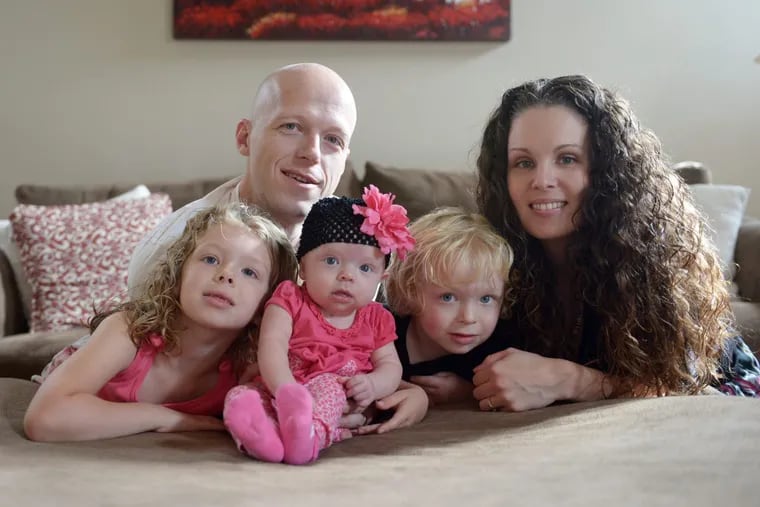 In this Sept. 1, 2014, photo, Willow Short, 4-month-old, center, along with her parents Megan and Mark and sister Liana, 6, and brother Mark, 3, poses for a photo in Sinking Spring, Pa. Willow Short had a heart transplant at 6-days-old. Mark Short shot all of them and himself in August 2016. Days earlier his wife had called police to their Berks County home. (Susan L. Angstadt/Reading Eagle via AP)