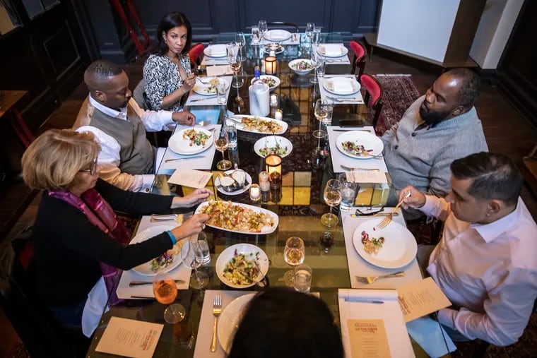 Community members gather for an On the Table session hosted by Philadelphia Inquirer columnist Jenice Armstrong at P.J. Clarke's restaurant in Center City on Thursday.