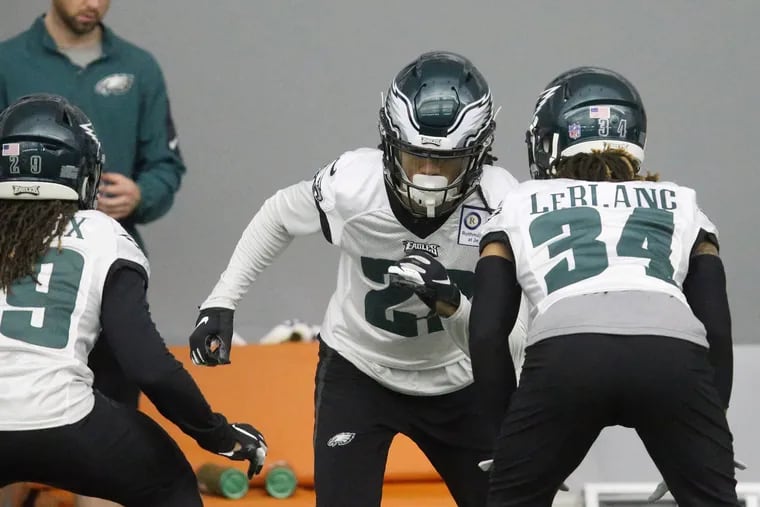 Eagles cornerback Sidney Jones (middle) running a drill with cornerback Cre'Von LeBlanc (34) during a January practice.
