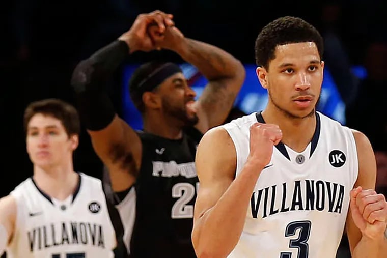 Villanova's Ryan Arcidiacono (15), who hit the deciding foul shots, with teammate Josh Hart after the victory in New York. (Yong Kim/Staff Photographer)