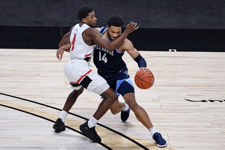 Villanova's Caleb Daniels (right) is fouled by Hartford's Moses Flowers on Dec. 1.