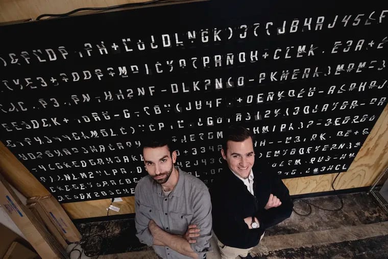 Sean Rossiter (left) and Mark Kuhn are two of the six Drexel University engineering grads who formed Oat Foundry in Philadelphia, makers of split-flap signs and other cool stuff.