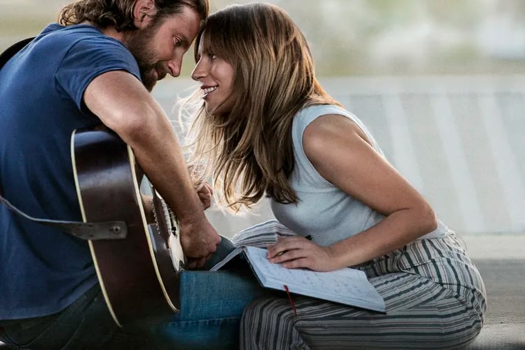This image released by Warner Bros. Pictures shows Bradley Cooper, left, and Lady Gaga in a scene from "A Star is Born." (Warner Bros. Pictures via AP)