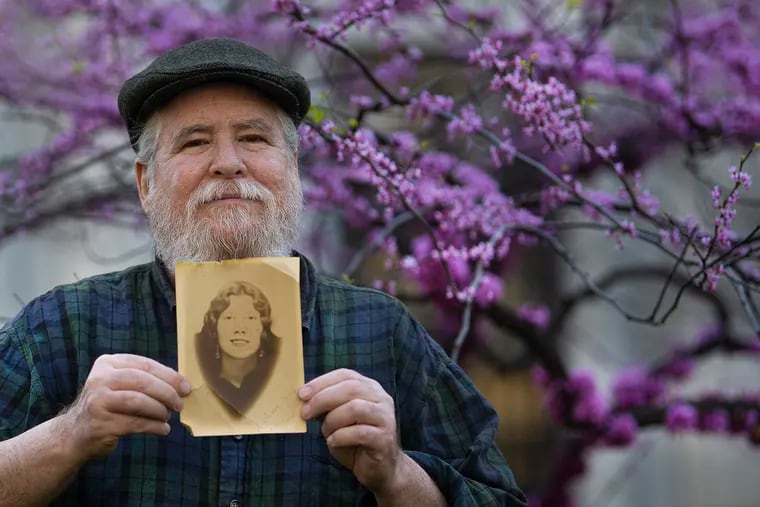 Bob McNulty is photographed with a picture of his grandmother, Susan Regina Casey Reis McNulty, at Washington Square Park. McNulty was inspired to start his popular Philadelphia Stories by Bob McNulty Facebook page in part, by his grandmother, who loved sharing stories of growing up in Philadelphia.