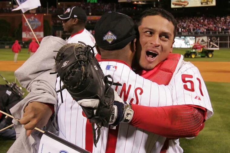 Carlos Ruiz (right) embracing Jimmy Rollins after the final out of the 2008 World Series.