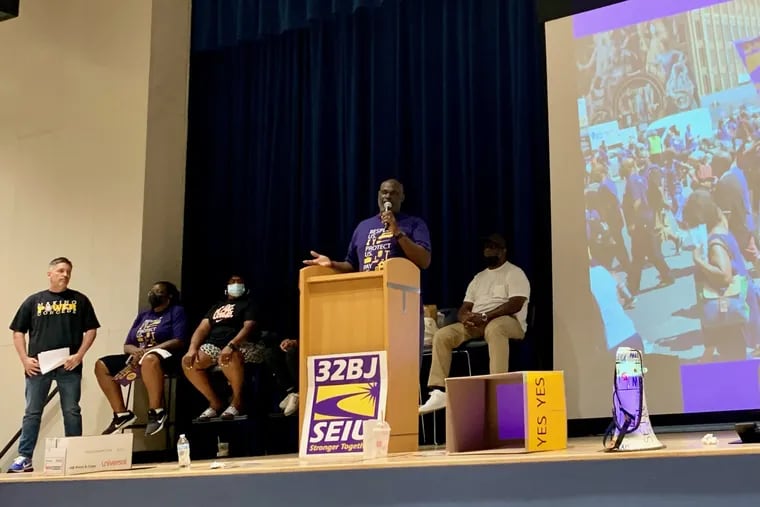 32BJ vice president John Bynum addresses members of the union prior to a contract vote Saturday.