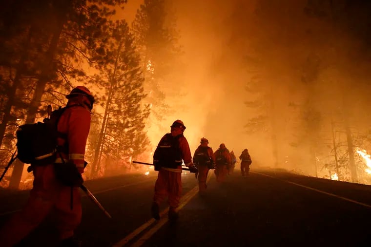 FILE photo shows California inmates fighting the wildfire near Yosemite National Park.
