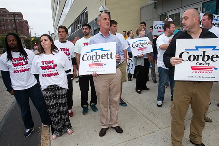 Supporters for Gov. Tom Corbett and candidate Tom Wolf gather outside CBS 3 studios on Wednesday, October 1, 2014. ( ALEJANDRO A. ALVAREZ / STAFF PHOTOGRAPHER )