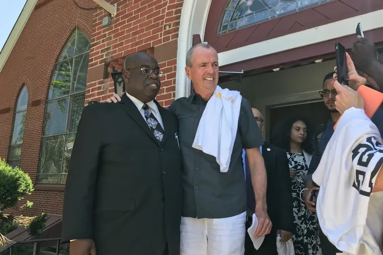 N.J. Gov. Murphy visits Galilee Baptist Church in Trenton Sunday to help calm city nerves after the early-morning shooting at the Art All Night festival. With him is Deacon Stacy Fannin.