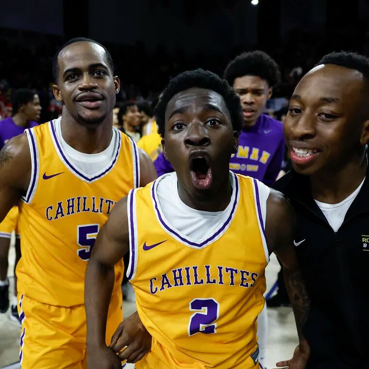 Roman Catholic’s Kabe Goss (2) rejoices after his shot at the buzzer beat Archbishop Ryan for the Catholic League championship.
