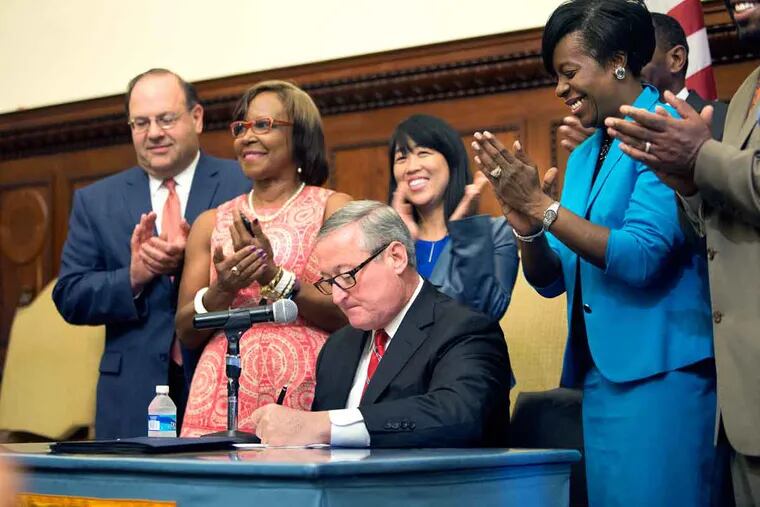 Mayor Kenney signs the sugary-drink tax into law Monday, June 20, 2016, at City Hall in Philadelphia.