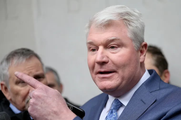 John Dougherty, pictured in a February 2019 file photo, addresses reporters as he leaves the federal courthouse in Philadelphia.