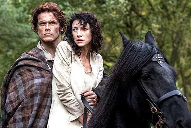 Sam Heughan as Jamie rescues Claire (Caitriona Balfe), who finds herself adrift in an alien land in &quot;Outlander,&quot; premiering Saturday on Starz. (McClatchy-Tribune)