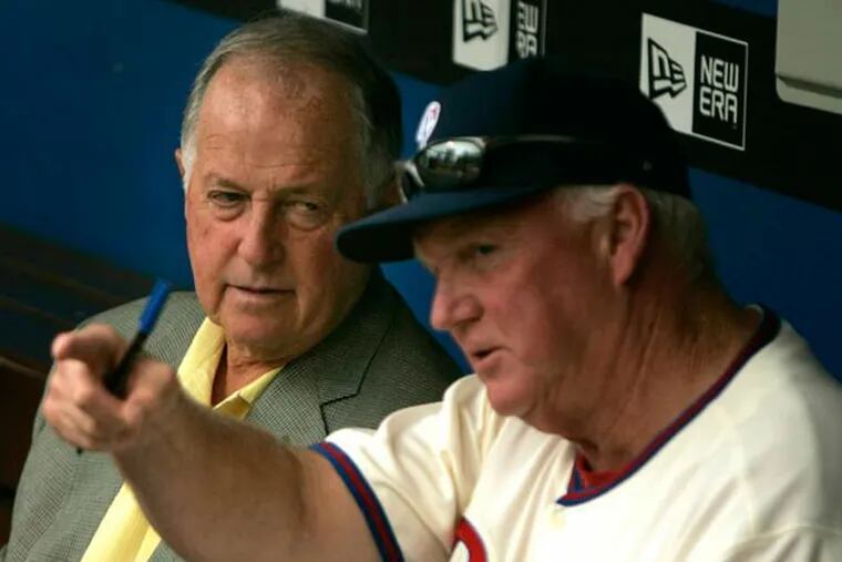 Phillies Charlie Manuel talks with Pat Gillick before the start of the game in 2008. (Ron Cortes/Staff file photo)