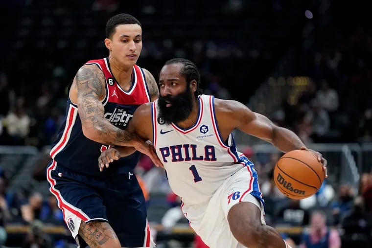 Sixers guard James Harden drives past Washington Wizards forward Kyle Kuzma in the second half.