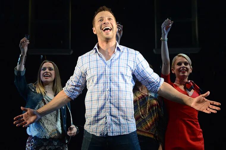 Justin Guarini with Chelsea Emma Franco (left) and Anne Horak in Bucks County Playhouse's production of &quot;Company.&quot; Bucks County's Guarini turns in a strong performance as struggling bachelor Bobby. MANDEE KUENZLE