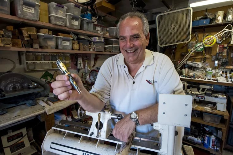 Barry Gross making custom pens in his Bensalem garage workshop. Gross, 65, retired from medical-device sales in 2012 and turned his hobby of making custom pens into a business. The pens sell for up to $1,000.